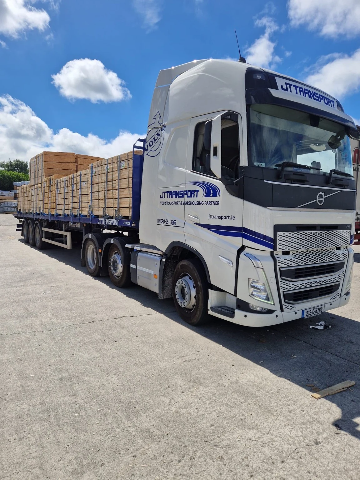 JT articulated vehicle carrying a timber load.